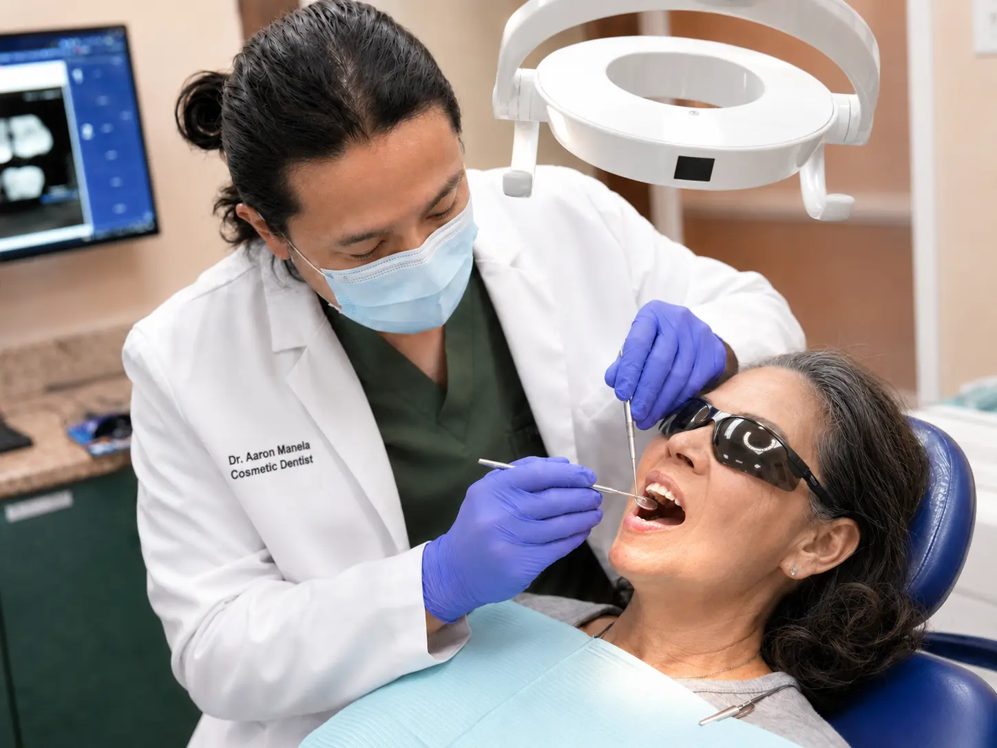 Dr. Aaron Manela, cosmetic and implant dentist at iCare Orthodontics and Dentistry in Norcross, GA